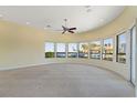 Bright living room featuring lots of large windows overlooking the canal and waterfront at 8 Ocean Dr, Punta Gorda, FL 33950