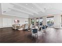 Spacious community room with comfortable seating, tables, and large windows at 1484 Mableton Dr, Port Charlotte, FL 33953