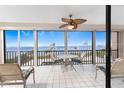 Breathtaking lanai featuring a table with chairs with scenic bay views, perfect for relaxing and enjoying sunsets at 1601 Park Beach Cir # 114/4, Punta Gorda, FL 33950