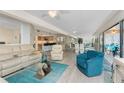 Open living room featuring contemporary furnishings and plenty of natural light at 1601 Park Beach Cir # 114/4, Punta Gorda, FL 33950