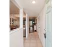 Inviting entryway with tile flooring leading to an open-concept kitchen and living area at 175 Kings Hwy # 717, Punta Gorda, FL 33983