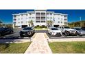 Front view of condominium with well manicured landscaping and convenient parking at 2001 Bal Harbor Blvd # 2202, Punta Gorda, FL 33950
