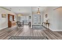Spacious foyer featuring beautiful flooring, elegant double doors, and a view into the dining area at 23531 Dunstan Ave, Port Charlotte, FL 33954