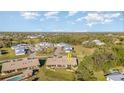Expansive aerial view showcasing the villa's community, set amongst a lush landscape at 26169 Explorer Rd # 7P, Punta Gorda, FL 33983