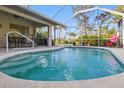 Inviting screened-in pool area, perfect for relaxation and outdoor entertaining at 121 Long Meadow Ln, Rotonda West, FL 33947