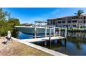 Private boat dock featuring a boat lift and easy access to the waterfront at 2002 Bal Harbor Blvd # 1022, Punta Gorda, FL 33950