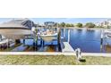 A private dock with a boat lift highlights waterfront living at 240 Lewis Cir # 28, Punta Gorda, FL 33950