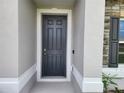 Close-up of a stylish front door with classic paneling and white trim at 354 Porto Alegre St, Punta Gorda, FL 33983
