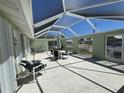 Spacious covered back patio offering ample space for outdoor seating and entertaining at 548 Belvedere Ct, Punta Gorda, FL 33950