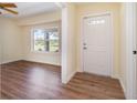 Inviting foyer features stylish floors, fresh paint and a charming front door at 7055 Riverside Dr, Punta Gorda, FL 33982