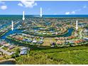 Breathtaking aerial view of a waterfront community with stunning blue waters and lush greenery at 1341 Pine Siskin Dr, Punta Gorda, FL 33950