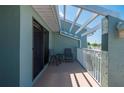 A cozy balcony with a table and chairs providing an inviting outdoor space at 1408 San Cristobal Ave # 4, Punta Gorda, FL 33983