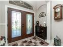 Welcoming foyer featuring a decorative glass door and elegant interior accents at 21 Manizaks Ave, Punta Gorda, FL 33983