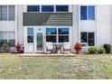 Charming condo exterior with a private patio, offering a cozy outdoor seating area at 2300 Aaron St # 106, Port Charlotte, FL 33952