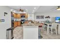 Updated kitchen with stainless steel appliances, custom cabinets, and granite countertops at 601 Shreve St # 36C, Punta Gorda, FL 33950