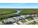 Gorgeous homes located along the water with mangroves on a sunny day at 609 Macedonia Dr, Punta Gorda, FL 33950