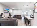 Open-concept living area with modern furnishings, laminate floors, and an inviting atmosphere at 14289 Manatee Rd, Parrish, FL 34219