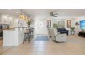 Spacious living area with an open floor plan, bar seating, and neutral tones offering modern comfort at 2308 Harbour Dr, Punta Gorda, FL 33983