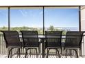 Relax and enjoy water views from this screened balcony with comfortable seating at 25188 Marion Ave # E409, Punta Gorda, FL 33950