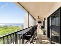 Enjoy expansive water views from this spacious balcony with comfortable seating and a ceiling fan at 25188 Marion Ave # E409, Punta Gorda, FL 33950