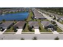 Stunning aerial view of a lakeside community showcasing beautiful homes and lush green spaces at 25325 E Lenox Cir, Punta Gorda, FL 33950