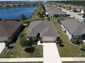 Gorgeous single-Gathering home with a well-manicured lawn and landscaping in a lakeside community at 25325 E Lenox Cir, Punta Gorda, FL 33950