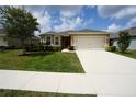 Lovely home with a well-maintained lawn, two car garage, and charming curb appeal at 25325 E Lenox Cir, Punta Gorda, FL 33950