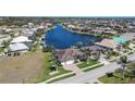 Expansive aerial view of waterfront homes with backyard boat docks lining deep-water canals in tropical neighborhood at 3606 Whippoorwill Blvd, Punta Gorda, FL 33950
