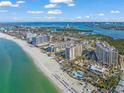 Panoramic aerial view of Lido Key beachfront condos and sparkling blue waters at 1212 Benjamin Franklin Dr # 102, Sarasota, FL 34236