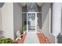 Welcoming front entrance with a screened porch and decorative accents at 1701 Lastingham Ln, Port Charlotte, FL 33980