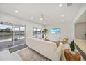 Cozy living room with sliding glass doors providing water views, perfect for relaxation and entertaining at 1791 Belle Ct, Punta Gorda, FL 33950
