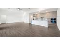 Modern kitchen featuring an island, stainless steel appliances, and ample storage space at 24166 Colima Ct, Punta Gorda, FL 33955