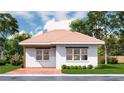 White brick home featuring large windows and a terra cotta colored roof with manicured landscaping at 20208 Winkler Ave, Port Charlotte, FL 33954