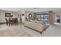 Bright living area with neutral tones, and sliding glass doors leading to a waterfront view at 2350 W Marion Ave, Punta Gorda, FL 33950