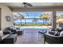 Relaxing waterfront views from the screened lanai with comfortable seating overlooking the refreshing pool and spa at 2917 Mill Creek Rd, Port Charlotte, FL 33953