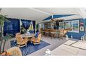 Outdoor patio featuring a unique bar area and comfortable seating, perfect for entertaining at 4279 Harbor Blvd, Port Charlotte, FL 33952