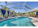 Enclosed swimming pool with a covered lanai, perfect for relaxing and entertaining outdoors at 4279 Harbor Blvd, Port Charlotte, FL 33952