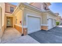 Up close view of a townhome exterior with an attached garage and convenient walkway to the front door at 240 W End Dr # 312, Punta Gorda, FL 33950