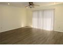 Bright living room with hardwood floors, neutral walls, and recessed lighting at 409 Ricold Ter, Port Charlotte, FL 33954