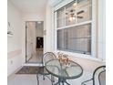Cozy tiled patio with outdoor seating, perfect for enjoying a quiet moment at 478 Winwood Ct, Port Charlotte, FL 33954