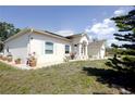 Beautiful home featuring solar panels and well-manicured landscaping at 7882 Dulce Ave, North Port, FL 34287