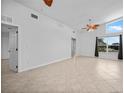 Spacious living room with high ceilings, tile floors, and neutral paint for a bright and airy feel at 955 Don Juan Ct, Punta Gorda, FL 33950