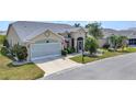 Charming home featuring well-maintained lawn, complemented by lush landscaping and a spacious driveway at 1848 Birmingham Blvd, Port Charlotte, FL 33980