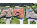 An aerial view of a single-Gathering home featuring a red tile roof, private pool, and waterfront access at 341 Segovia Dr, Punta Gorda, FL 33950