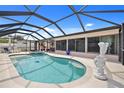 Private screened-in pool featuring a tranquil oasis with serene blue waters at 4114 Yucatan Cir, Port Charlotte, FL 33948