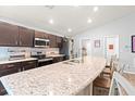 Modern kitchen featuring granite countertops, stainless steel appliances, and ample counter space at 6315 164Th E Ave, Parrish, FL 34219