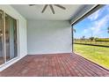 Screened-in lanai with brick flooring overlooking a spacious backyard at 7028 N Plum Tree, Punta Gorda, FL 33955
