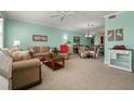 Bright and inviting living room featuring tile floors, comfortable seating, and a stylish dining area at 2001 Bal Harbor Blvd # 2312, Punta Gorda, FL 33950