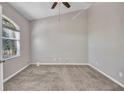 Neutral bedroom featuring carpet, a ceiling fan, a window with blinds, and electrical outlets at 4331 Marcella Ter, North Port, FL 34286