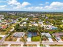 Charming single-story home with a well-maintained lawn and mature trees in a quiet residential neighborhood near the water at 1137 Ponderosa Rd, Venice, FL 34293